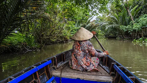 Getty Images A boat ride through Vietnam's Mekong Delta is one of the most immersive ways to experience local life (Credit: Getty Images)