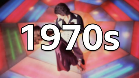 Two dancers, one male and one female, stand on a colourful lit up dancefloor in the 1970s. The man wears a black and white suit with flared pants and the woman has curly hair and a long burgundy dress. The image is blurred as the text '1970s' is the focus of the image