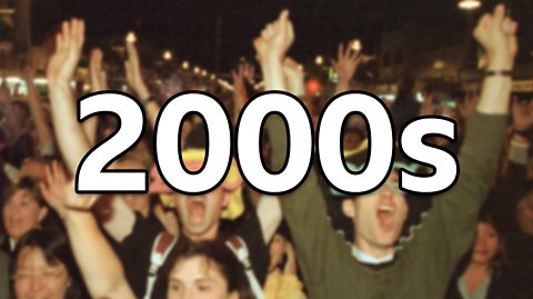 A crowd cheers wearing fun hats and glasses as they celebrate the new millennium. The image is blurred as the focus is the text which reads '2000s'