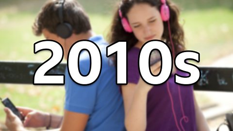 A man wearing a blue top and black headphones listens to music as he sits with his back to a woman with curly brown hair wearing a dark purple top. She wears pink headphones and listens to music on her music player. The image is blurred as the focus is text reading '2010s'