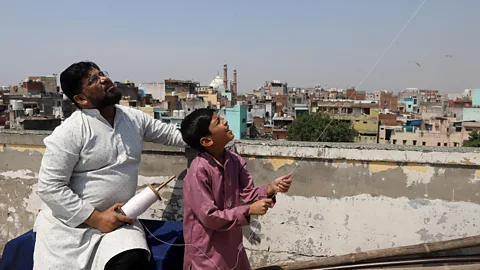 Vijay Pandey Sayed Jamaluddin tries to make time to teach his son Afnan to fly kites in the hope of keeping the sport his father loved alive (Credit: Vijay Pandey)