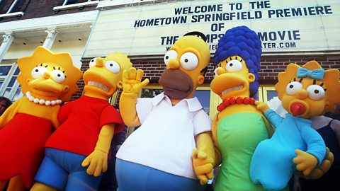 Mascot versions of the Simpson family stood in front of a cinema in Springfield, Vermont in the United States for the premiere of The Simpsons Movie