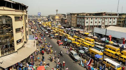  Taxi vans in heavy traffic on Nnamdi Azikwe Street by Idumota market in Lagos, Nigeria