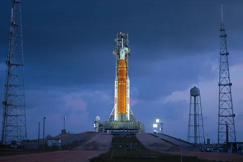 Getty Images At 322ft (98m) tall, the SLS rocket is smaller than the 363ft (111m) tall Saturn V used in the Apollo missions, but it is far more powerful (Credit: Getty Images)