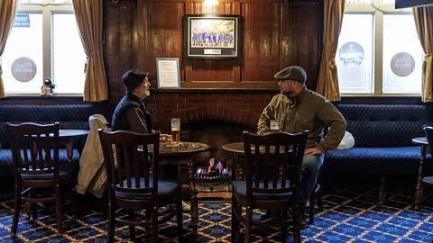 Getty Images In Britain, the pub is often as much a communal living room as a place to drink (Credit: Getty Images)