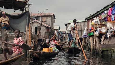 People navigate the waterways of Makoko waterfront community in Lagos.