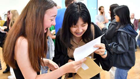 Two students receiving their GCSE results.