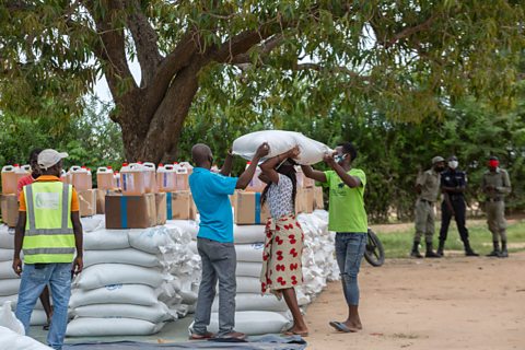A woman receiving food during a United Nations World Food Program's distribution in Mozambique