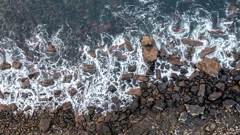 Getty Images If you were to measure every barnacle, grain of sand or atom along England's coastline, the measurement would approach infinity (Credit: Getty Images)