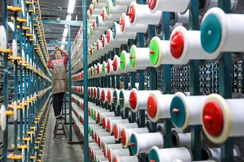 Getty Images Textile workers are exposed to higher levels of microplastic pollution than many, which may come with health risks (Credit: Getty Images)