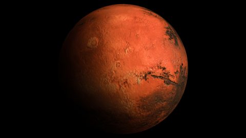 High-resolution 3D close-up view of the planet Mars showing its rugged surface, reddish terrain, and detailed geological features