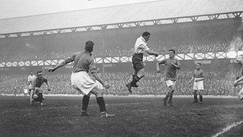 A football match featuring Dixie Dean, from the 1920s, the decade Queen Elizabeth II was born.