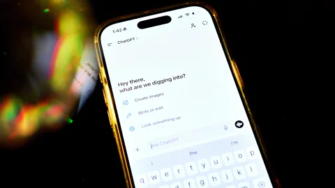 Getty Images A phone with ChatGPT on the screen with the words "Hey there, what are we digging into?" displayed (Credit: Getty Images)