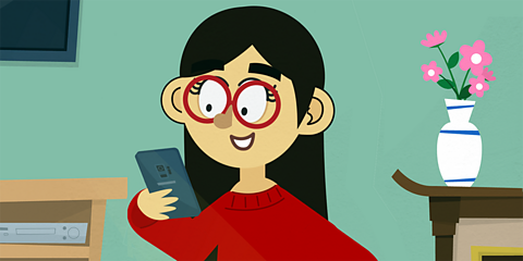 A young girl answering her mobile phone