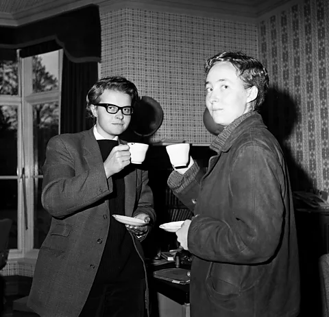 Getty Images Rose Dugdale (left) and Jennifer Grove dressed as men to sneak into a male-only debate at the University of Oxford (Credit: Getty Images)