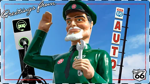 Serenity Strull/ BBC/ Getty Images A male action figure in a green filling station uniform raises his hand in greeting in front of Route 66 signs (Credit: Serenity Strull/ BBC/ Getty Images)