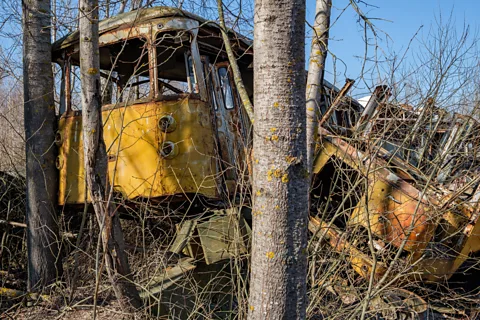 Kamil Budzynski Polish photographer Kamil Budzynski has visited Chernobyl after Rassokha was cleared, and found the remains of many vehicles in forest clearings (Credit: Kamil Budzynski)
