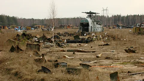 Phil Coomes/ BBC Some of the larger vehicles, such as the heavylift helicopters, appeared to have been picked apart by metal scavengers when Phil Coomes visited in 2006 (Credit: Phil Coomes/ BBC)