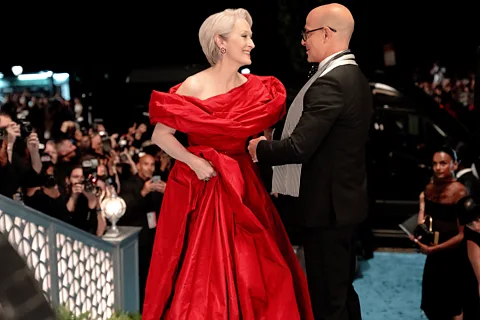 20th Century Fox Meryl Streep in a red gown next to Stanley Tucci in The Devil Wears Prada 2 (Credit: 20th Century Fox)