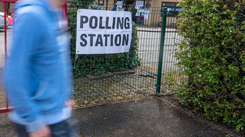 An image of a young person outside a polling station in the UK
