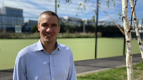 Image of Jamie Masraff, CEO of On Side Youth Zone charity. He is standing by a tree at one of the Youth Zones.