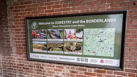 Richard Collett Even visitor signs in Oswestry lean into the town's borderland status (Credit: Richard Collett)