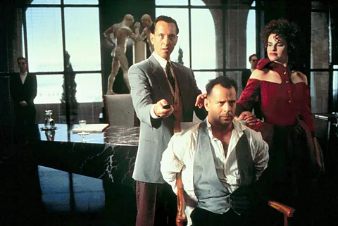 Alamy Richard E Grant, Bruce Willis and Sandra Bernhard in a scene from the film, which Grant described as "a steaming pile of donkey droppings" (Credit: Alamy)