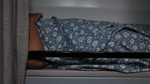 Jamie Fullerton Assigned bedsheets, reading lights and charging ports mark a step up from India's older sleeper trains (Credit: Jamie Fullerton)