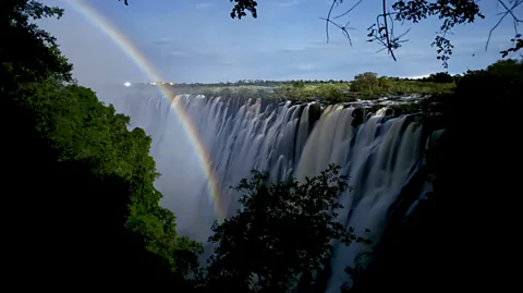 Sarah Steger A rainbow-like lunar rainbow arcs through the mist in front of Victoria Falls at night (Credit: Sarah Steger)
