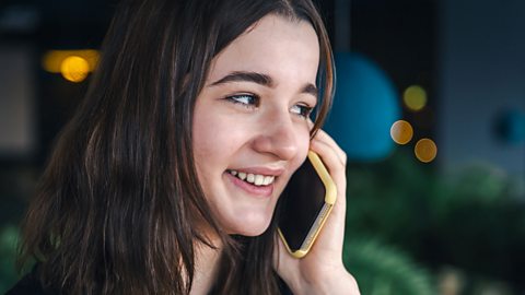 Teenager talking on the phone.