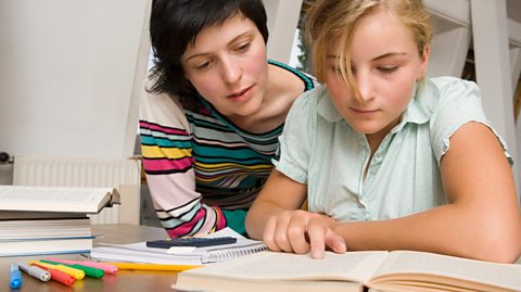 Mum helps her daughter with revision 