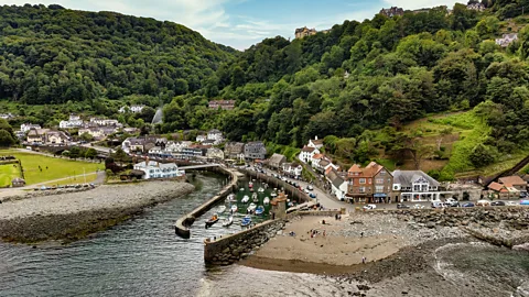 Getty Images Aerial view of small harbour village in England with fishing boats moored between breakwaters (Credit: Getty Images)