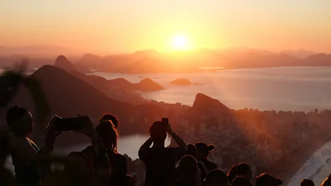 Joel Balsam Hordes of travellers hike up to the top of the Vidigal favela to see the sunrise each morning (Credit: Joel Balsam)