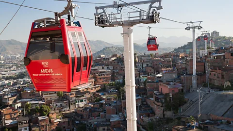 Alamy Cable cars go over several of Rio's favelas (Credit: Alamy)