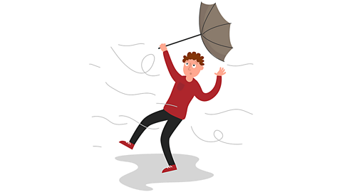 A man is blown away by the wind as his umbrella turns inside out.