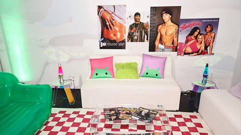 A mock up of a 00s style bedroom with decor like an inflatable green chair and posters of popular singers and album covers of the time