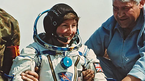 Courtesy of Helen Sharman Helen Sharman in astronaut gear next to two men (Credit: Courtesy of Helen Sharman)