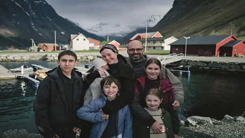 Courtesy of Cannes FIlm Festival Sebastian Stan and Renate Reinsve pose with their five on-screen children in Fjord (Credit: Courtesy of Cannes FIlm Festival)