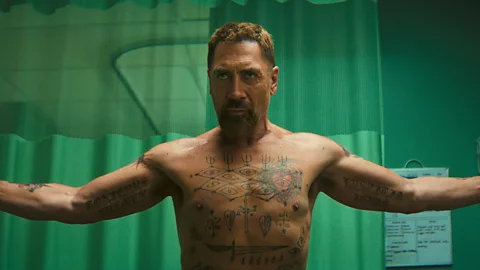 Apple TV Javier Bardem shirtless with arms extended in Cape Fear (Credit: Apple TV+)