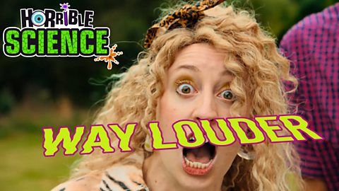 A woman has her mouth open in an exaggerated shouting expression. Way louder.