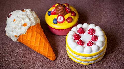 An image showing three squishie toys, one shaped like an ice cream, the other a cake and the third a dessert
