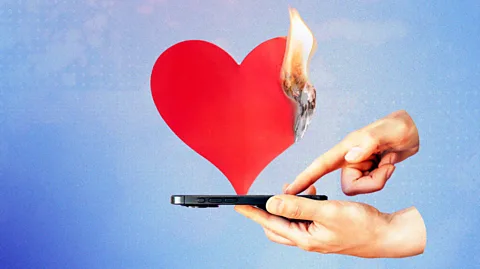 Serenity Strull/ BBC/ Getty Images Art of hands pressing on a smartphone, with a big red heart being burned by flames over the phone (Credit: Serenity Strull/ BBC/ Getty Images)
