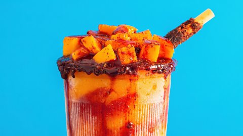 An image of a Mexican mangonada - a fruit, spicy drink that is similar to a smoothie