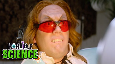 Image of Vladimir the vampire wearing red goggles at the dentist