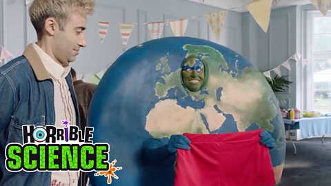 Image of Horrible Science Earth character holding a pair of red shorts. 