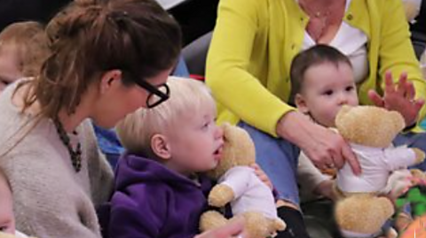 Grown ups and children at a CBeebies Parenting Stay and Play session