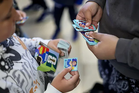 Alamy Swapping football stickers with friends or strangers is often the only way people can get close to a complete set (Credit: Alamy)