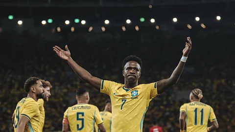 Getty Images Brazilian striker Vinicius Junior holds his hands aloft in celebration during a friendly match against Panama (Credit: Getty Images)