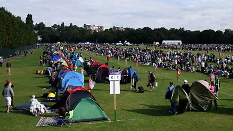 Getty Images The Queue transforms Wimbledon Park into a vast overnight campsite (Credit: Getty Images)