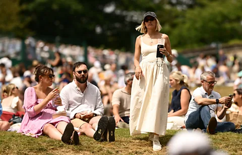 Getty Images The Hill is one of Wimbledon's most iconic gathering places, where spectators picnic and watch the tennis together (Credit: Getty Images)